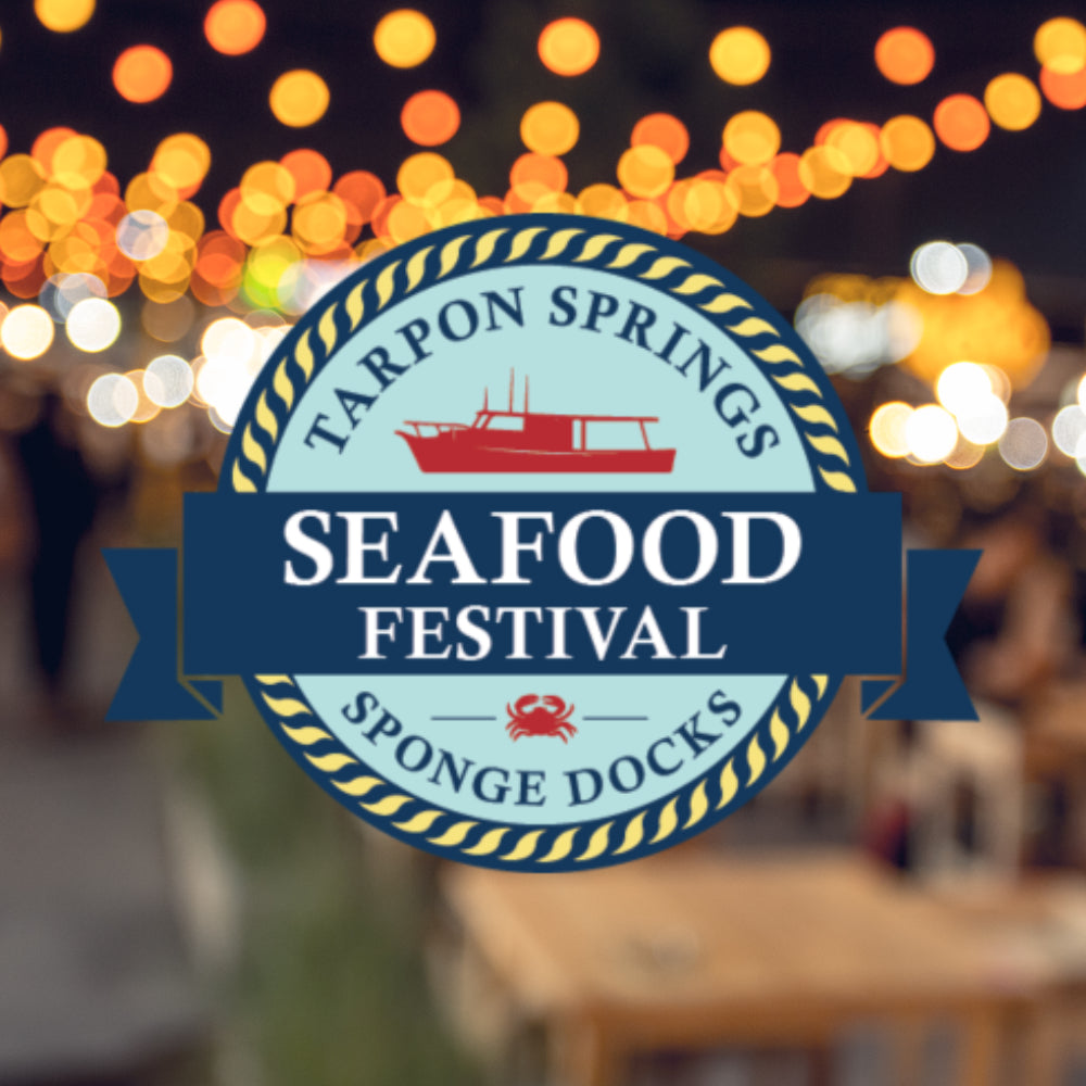 Logo for Tarpon Springs Seafood Festival with blurred lights in the background