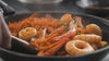 Video of different seafood being cooked.